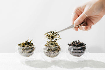 set of three different green and black loose leaf teas